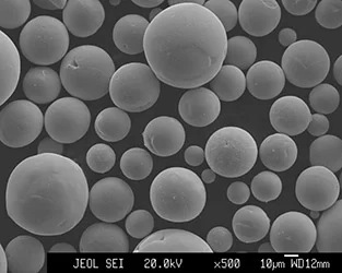 SEM image of plasma-spheroidized niobium powder 15-45 microns — highly spherical particles with minimal satellites for LPBF additive manufacturing